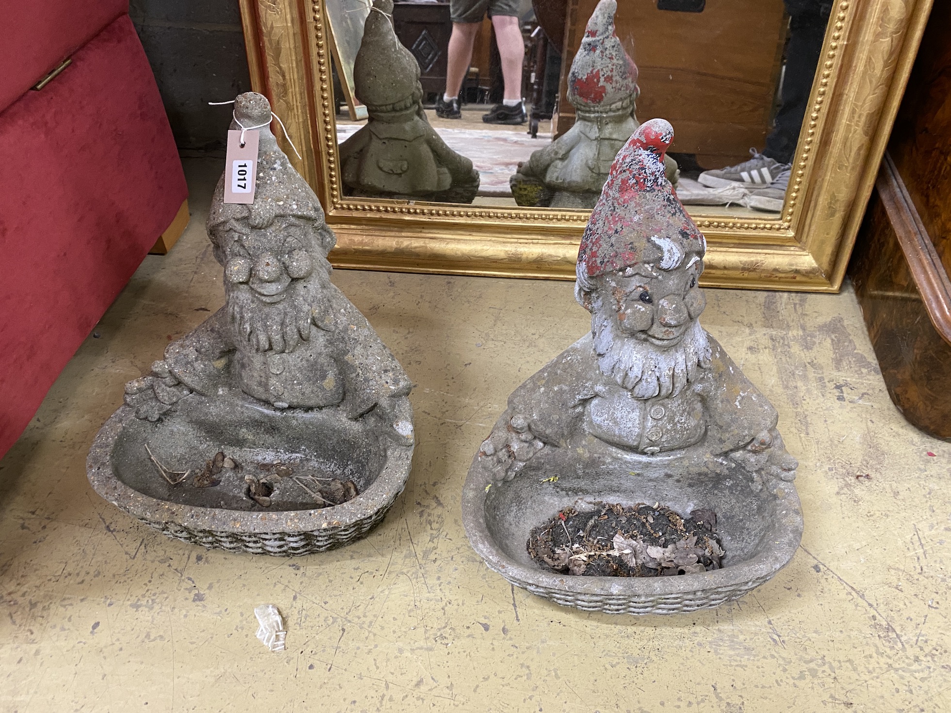 A pair of cast stone gnome bird baths, height 40cm